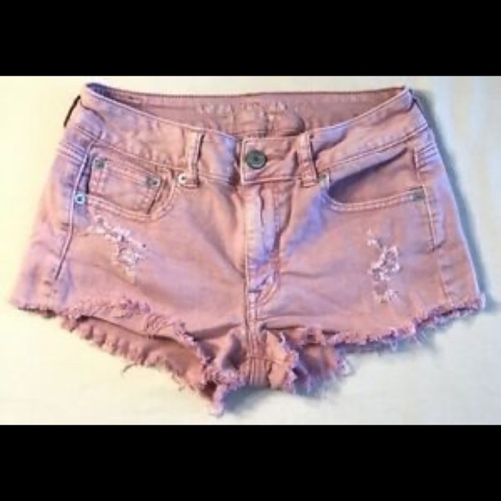 Pink distressed denim shorts